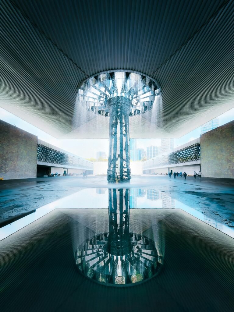 Stunning vertical shot of the iconic fountain at the National Museum, reflecting architectural elegance.